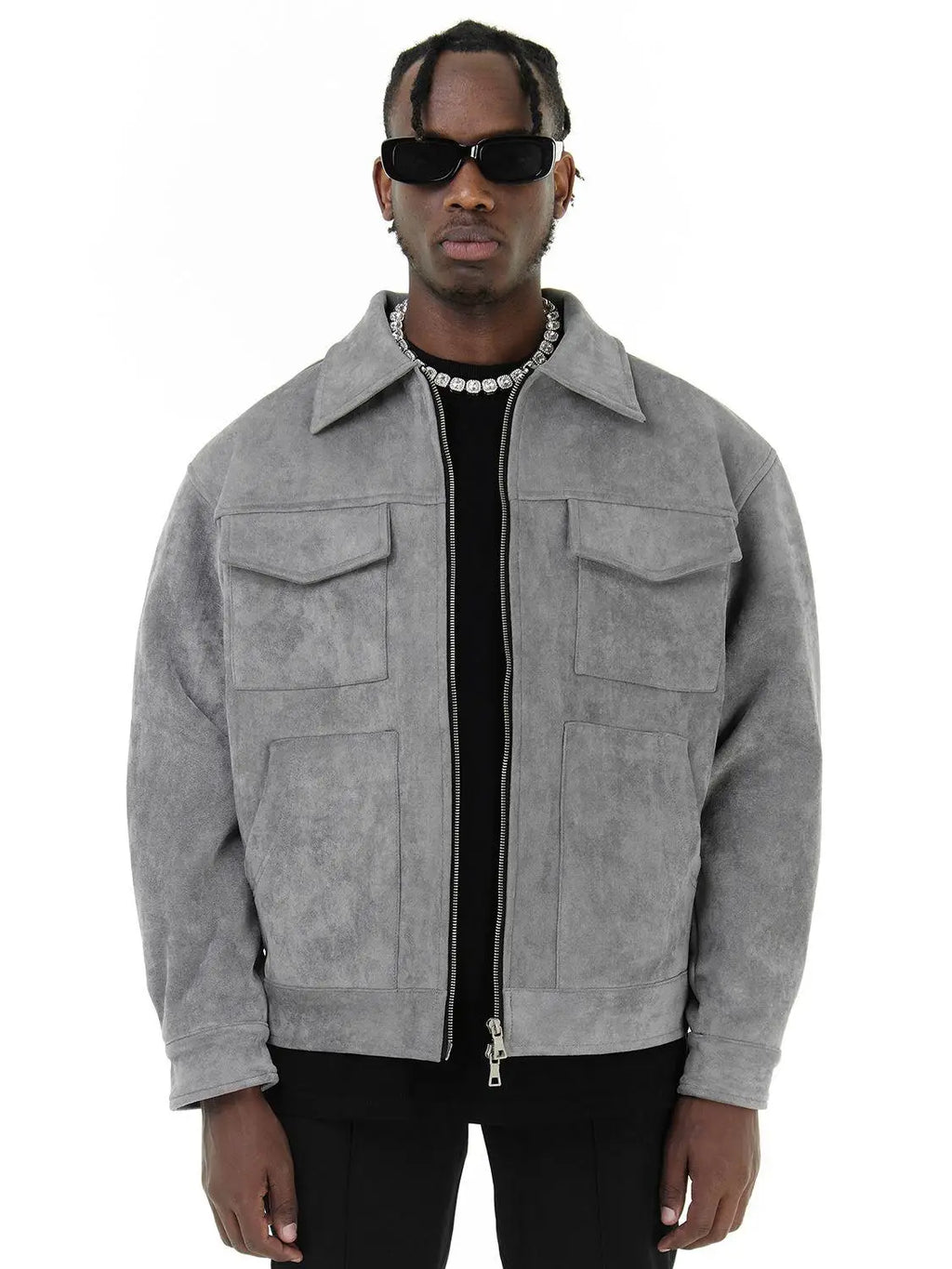 Man wearing a gray suede jacket on a white background